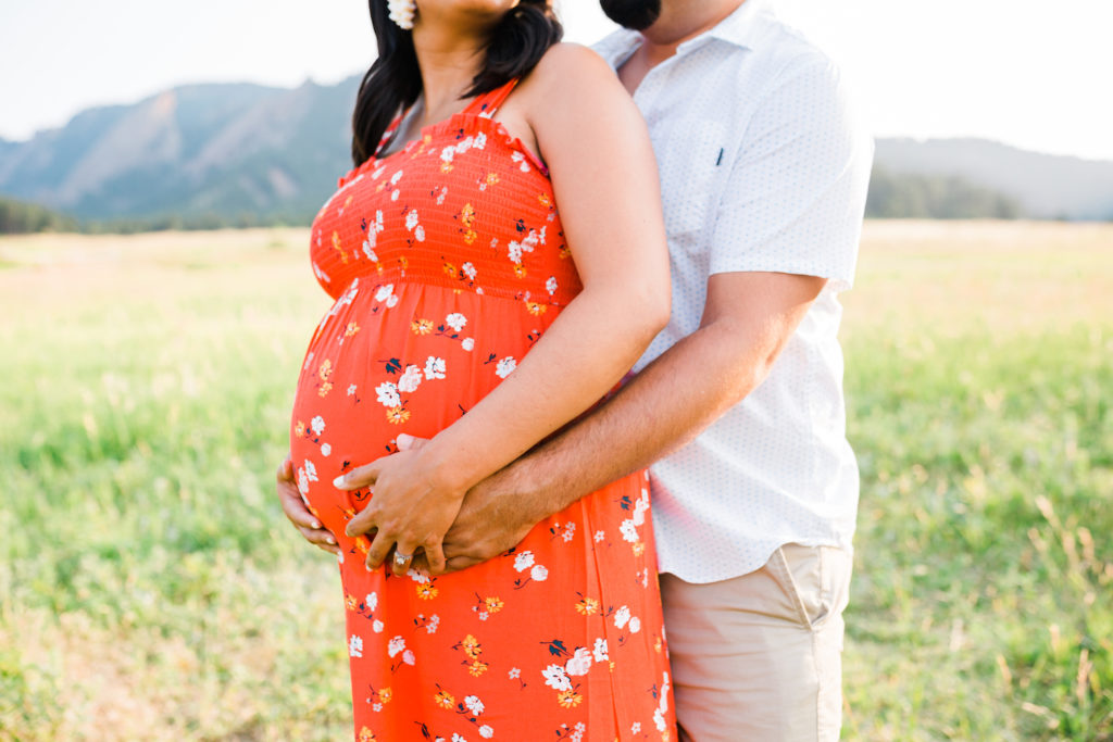 focusing on the baby bump during a Denver maternity session
