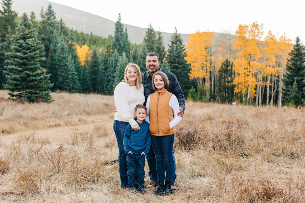 family snuggled together for fall family photos 